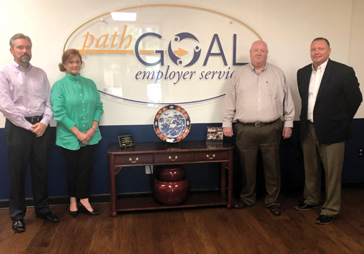 The leadership at PathGoal Employer Services is changing the face of human resources services. From left: Jeff Morris, Vice President of Sales; Lori Laubach, Vice President of Human Resources; John Limpert, Sales Consultant; and Adam Doman, President.